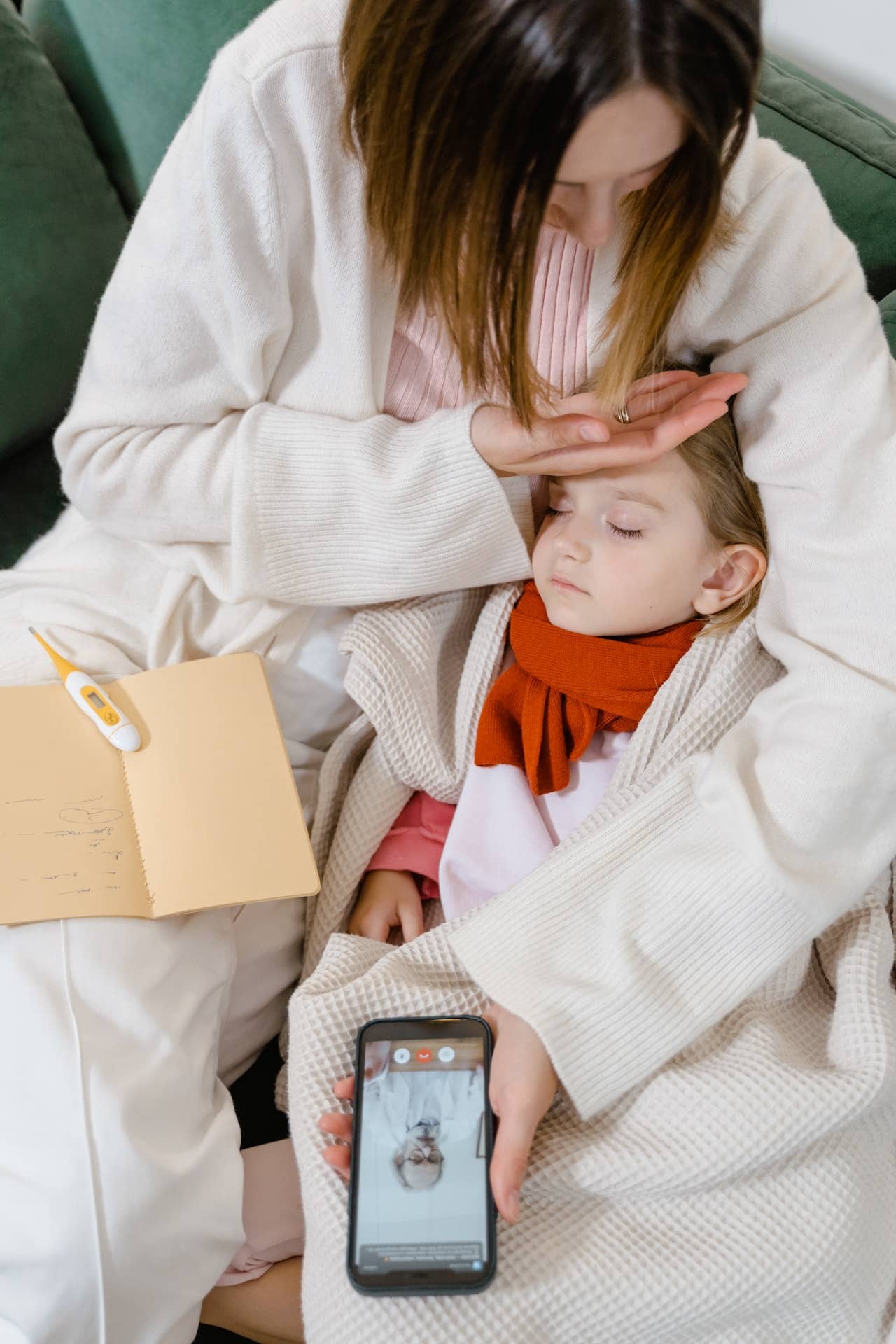 mother child has fever telemed doctor on phone-telehealth-telemedicine