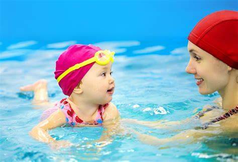 summer-teaching how to swim for babies 2 years