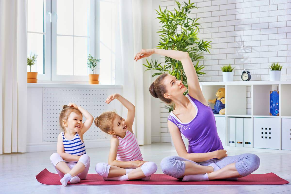 mother and daughters doing exercise